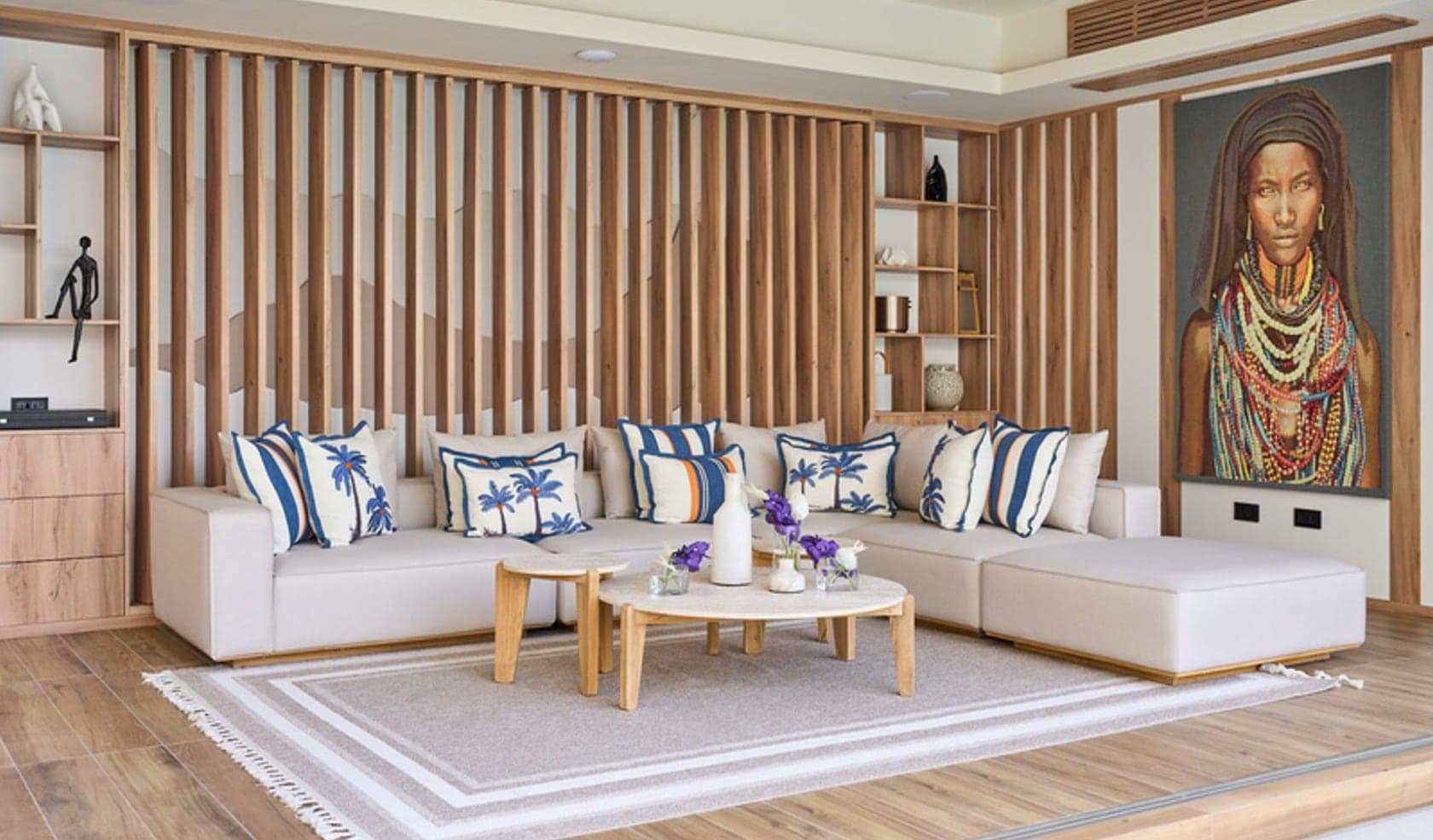 Living room lined with floor-to-ceiling vertical oak slat panelling and integrated display niches
