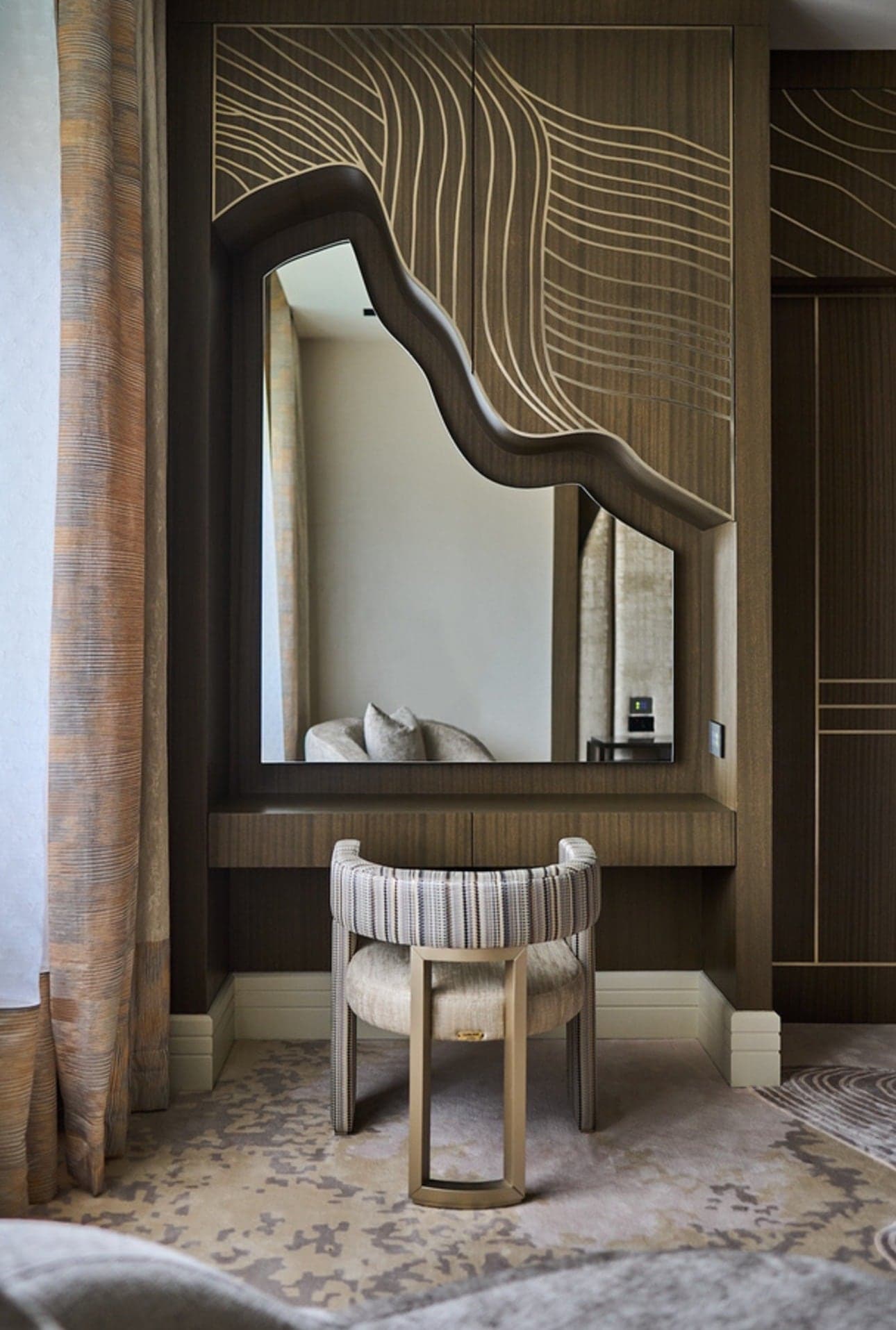 Dressing table with a shaped mirror, upholstered stool and line-detailed panelling